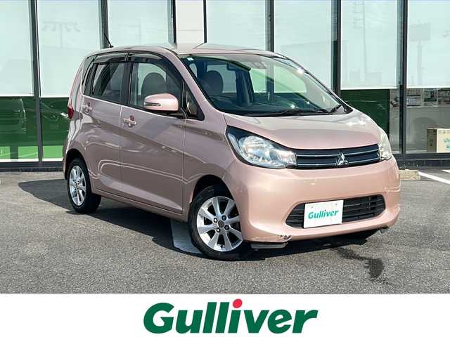 三菱 ｅＫワゴン G e－アシスト 岐阜県 2015(平27)年 6.8万km サクラピンクメタリック 登録時走行距離67796km/社外７型ナビ　/Bluetooth/ＥＴＣ　/純正１４インチアルミホイール　/プッシュスタート　/スマートキー　/ＡＢＳ　/横滑り防止装置　/衝突軽減システム　/アイドリングストップ　/フロアマット　/ベンチシート　/フラットシート/ライトレベライザー