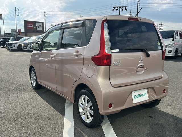 三菱 ｅＫワゴン G e－アシスト 岐阜県 2015(平27)年 6.8万km サクラピンクメタリック 登録時走行距離67796km/社外７型ナビ　/Bluetooth/ＥＴＣ　/純正１４インチアルミホイール　/プッシュスタート　/スマートキー　/ＡＢＳ　/横滑り防止装置　/衝突軽減システム　/アイドリングストップ　/フロアマット　/ベンチシート　/フラットシート/ライトレベライザー