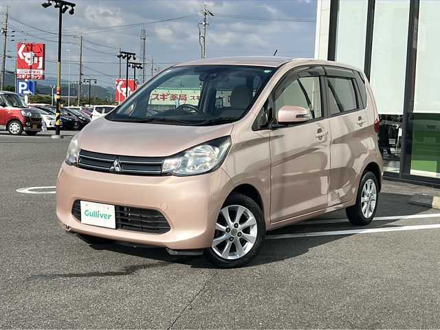 三菱 ｅＫワゴン G e－アシスト 岐阜県 2015(平27)年 6.8万km サクラピンクメタリック 登録時走行距離67796km/社外７型ナビ　/Bluetooth/ＥＴＣ　/純正１４インチアルミホイール　/プッシュスタート　/スマートキー　/ＡＢＳ　/横滑り防止装置　/衝突軽減システム　/アイドリングストップ　/フロアマット　/ベンチシート　/フラットシート/ライトレベライザー