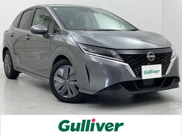 日産 ノート X 茨城県 2023(令5)年 0.9万km ダークメタルグレー 純正9型ナビ/全周囲カメラ/フルセグ/ワイヤレス充電/プロパイロット/衝突被害軽減ブレーキ/車線逸脱抑制装置/オートマチックハイビーム/ソナー/BSI/ETC2.0/ドラレコ/LEDヘッドライト/スマートキー