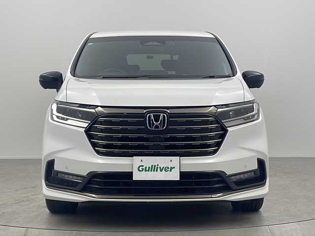 ホンダ オデッセイ ハイブリッド e:HEVアブソルート EXブラックED 大阪府 2023(令5)年 1.9万km プラチナホワイトパール 純正11インチナビ/【フルセグＴＶ/ＡＭ/ＦＭ/ＣＤ/ＤＶＤ/ＢＴ/ＵＳＢ/ＨＤＭＩ//ＡｐｐｌｅＣａｒＰｌａｙ/ＡｎｄｒｏｉｄＡｕｔｏ】/純正ドライブレコーダー前後/ETC/バックカメラ(全方位)/Honda SENSING/・衝突軽減ブレーキ/・誤発進抑制機能/・後方誤発進抑制機能/・近距離衝突軽減ブレーキ/・歩行者事故低減ステアリング/・路外逸脱抑制機能/・追従機能付きアダプティブクルーズコントロール/・車線維持支援システム/・先行車発進お知らせ機能/・標識認識機能/・オートハイビーム/・ブラインドスポットインフォメーション/・パーキングセンサーシステム/・後退出庫サポート/パワーシート(D席・N席・2列目)/シートヒーター(D席・N席・２列目)/オットマン(2列目)/両側パワースライドドア/パワーバックドア/純正フロアマット/スマートキー