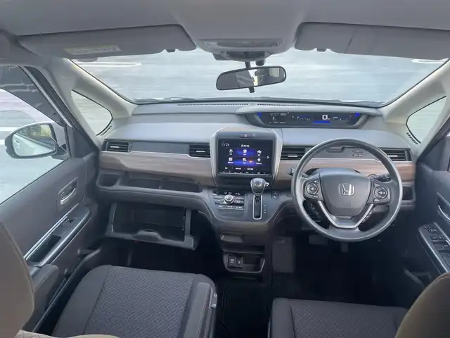 ホンダ フリード G ホンダセンシング 東京都 2020(令2)年 1.7万km プラチナホワイトパール ワンオーナー/Gatheres製　９インチプレミアインターナビ/（MUSIC ROCK/BT/DVD/CD)/バックカメラ/純正ドライブレコーダー（DRH-204VD)/助手席リフトアップシート/両側パワースライドドア/ビルトインETC/ヒーテッドミラー/アイドリングストップ/エンジンプッシュボタン/社外１５インチアルミ/バイザー・マット/ホンダセンシング/衝突軽減ブレーキ/誤発進抑制機能/後方誤発進抑制機能/歩行者事故低減ステアリング/先行車発進お知らせ/標識認識機能/アダプティブクルーズコントロール/車線維持支援システム/スペアキー１本/保証書・取説