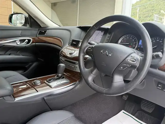 日産 フーガ ハイブリッド 香川県 2017(平29)年 5万km スーパーブラック ワンオーナー/メーカーナビ/フルセグ/アラウンドビューモニター/ハーフレザーシート/前席パワーシート/オットマン/純正18インチアルミ/LEDヘッドライト/エマージェンシーブレーキ/レーダークルーズコントロール/BSM/ドライブレコーダー/スマートキー/ビルトインETC