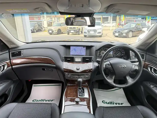 日産 フーガ ハイブリッド 香川県 2017(平29)年 5万km スーパーブラック ワンオーナー/メーカーナビ/フルセグ/アラウンドビューモニター/ハーフレザーシート/前席パワーシート/オットマン/純正18インチアルミ/LEDヘッドライト/エマージェンシーブレーキ/レーダークルーズコントロール/BSM/ドライブレコーダー/スマートキー/ビルトインETC