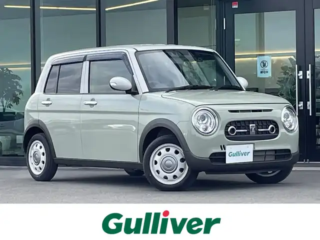 スズキ ラパン X 東京都 2025(令7)年 1.3万km トラッドカーキメタリック/ソフトベージュ 2トーン 純正ディスプレイオーディオ/ドライブレコーダー/フロアマット/Bluetooth/クリアランスソナー/前席シートヒーター/バックカメラ/革巻きステアリング/ステアリングスイッチ/アイドリングストップ/レーンキープアシスト/衝突軽減ブレーキ/ハーフレザーシート