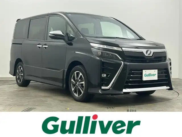 トヨタ ヴォクシー ZS 煌Ⅱ 岡山県 2019(平31)年 5.2万km ブラック 純正9インチナビ/ナビ型番：NSZT-Y68T/【CD/DVD/Bluetooth/フルセグTV】/両側パワースライドドア/バックカメラ/純正ドライブレコーダー(前)/LEDヘッドライト/クルーズコントロール/衝突軽減ブレーキシステム/オートライト/オートハイビーム/コーナーセンサー/ウインカーミラー/シートバックテーブル/シートリフター/チルドステアリング/ステアリングスイッチ/後席サンシェード/レーンアシスト/横滑り防止装置