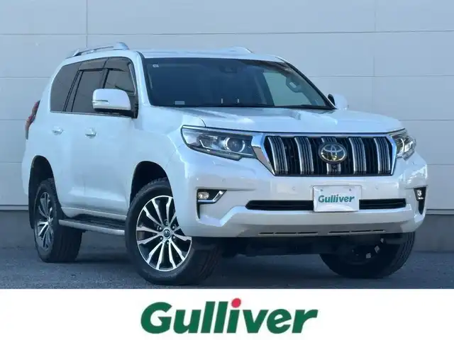 トヨタ ランドクルーザー プラド TZ－G 茨城県 2019(令1)年 5万km ホワイトパールクリスタルシャイン ワンオーナー/純正ナビ/　(AM/FM/CD/DVD/USB/Bluetooth/フルセグ)/全方位カメラ/前方ドライブレコーダー/クリアランスソナー/レーダークルーズコントロール/ETC2.0/LEDヘッドライト/レザーシート/シートベンチレーション/SoundWaveセキュリティシステム/ルーフレール/電動格納3列シート/純正アルミホイール/レーンキープアシスト/オートライト/W+サイドエアバック/カーテンエアバック/パワーステアリング/ワンオーナー/新車時保証書