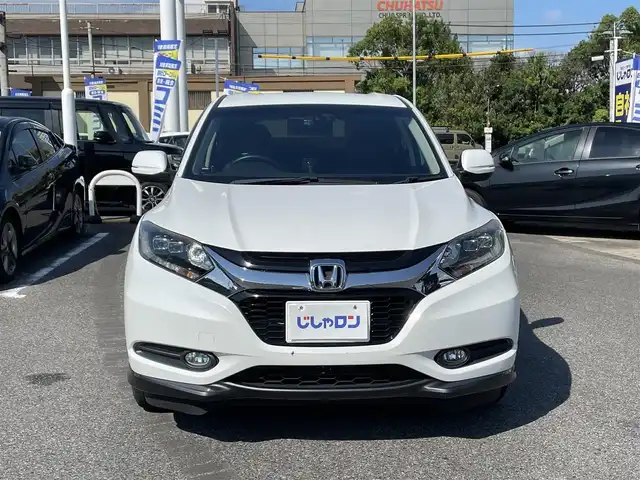 ホンダ ヴェゼル ハイブリッド X 愛知県 2014(平26)年 12.9万km ホワイトオーキッドパール (株)IDOMが運営する【じしゃロン名古屋鳴海店】の自社ローン専用車両になりますこちらは現金またはオートローンご利用時の価格です。自社ローンご希望の方は別途その旨お申付け下さいプッシュスタート/レザーシート/シートヒーター/純正ナビ・フルセグTV/　（CD/DVD.BT）/バックカメラ/クルーズコントロール/ドライブレコーダー/ETC