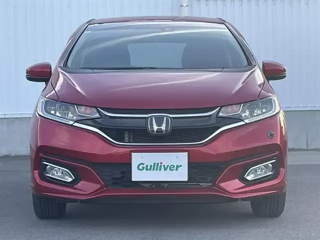 ホンダ フィット 13G L ホンダセンシング 愛媛県 2018(平30)年 5.2万km プレミアムクリスタルレッドM ホンダセンシング/アダプティブクルーズコントロール/純正7インチナビ【VXM-185VFi】/　CD/DVD/Bluetooth/フルセグ/バックカメラ/ビルトインETC/前方ドライブレコーダー/プッシュスタート/LEDヘッドライト/フロントフォグ/ステアリングスイッチ