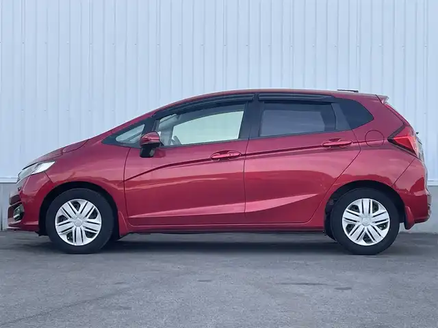 ホンダ フィット 13G L ホンダセンシング 愛媛県 2018(平30)年 5.2万km プレミアムクリスタルレッドM ホンダセンシング/アダプティブクルーズコントロール/純正7インチナビ【VXM-185VFi】/　CD/DVD/Bluetooth/フルセグ/バックカメラ/ビルトインETC/前方ドライブレコーダー/プッシュスタート/LEDヘッドライト/フロントフォグ/ステアリングスイッチ