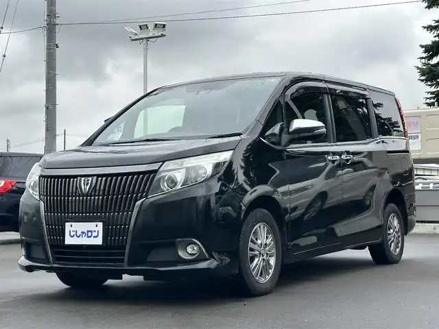 トヨタ エスクァイア Gi ブラックテーラード 道北・旭川 2016(平28)年 13.1万km ブラック (株)IDOMが運営する【じしゃロン旭川店】の自社ローン専用車両になります。こちらは現金またはオートローンご利用時の価格です。自社ローンご希望の方は別途その旨お申付け下さい/　/・純正ナビ(CD/DVD/BT/SD/フルセグ)/・バックカメラ/・ETC/・レーダーブレーキ/・ドライブレコーダー/・クルーズコントロール/・ステアリングリモコン/・両席パワースライドドア/・両席シートヒーター/・フリップダウンモニター/・プッシュスタート/・スマートキー２個/・フォグランプ/・取扱説明書