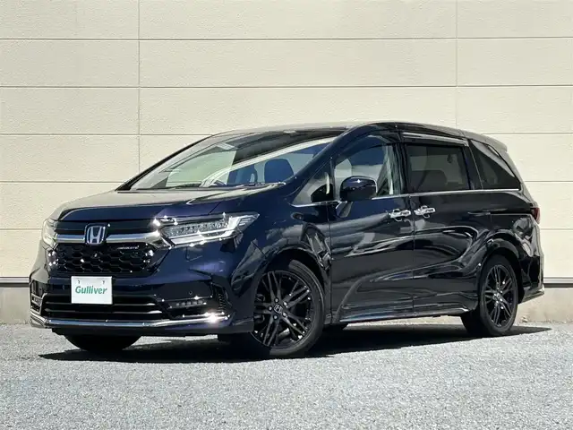 ホンダ オデッセイ ハイブリッド e:HEVアブソルート EX 茨城県 2022(令4)年 1.6万km プレミアムヴィーナスブラックP ワンオーナー/10インチ純正ナビ/全方位カメラ/両側パワースライドドア/LEDヘッドライト/BSM/ホンダセンシング/レーダークルーズコントロール/ハーフレザーシート/シートヒーター/パワーシート/パワーバックドア/純正フロアマット/ドアバイザー/スプッシュスタート/スマートキー×２/WAC/ビルドインETC/コーナーセンサー