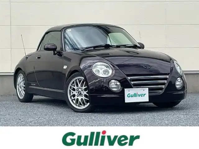 ダイハツ コペン ULTIMATE Ⅱ メモリアル 茨城県 2007(平19)年 8.4万km ダークレッドマイカ 100周年記念特別仕様車/社外メモリナビ/（フルセグＴＶ／Ｂｌｕｅｔｏｏｔｈ／ＤＶＤ／ＣＤ／ＦＭ／ＡＭ）/電動ルーフ/社外ＢＢＳアルミホイール/サクラムマフラーキット/レカロシート/MOMO製ステアリング/DSPORTカーボンタワーバー/ピボットマルチメーター（回転数・ブースト・水温）/シートヒーター/ETC/純正フロアマット/キーレス