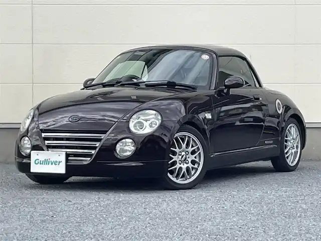 ダイハツ コペン ULTIMATE Ⅱ メモリアル 茨城県 2007(平19)年 8.4万km ダークレッドマイカ 100周年記念特別仕様車/社外メモリナビ/（フルセグＴＶ／Ｂｌｕｅｔｏｏｔｈ／ＤＶＤ／ＣＤ／ＦＭ／ＡＭ）/電動ルーフ/社外ＢＢＳアルミホイール/サクラムマフラーキット/レカロシート/MOMO製ステアリング/DSPORTカーボンタワーバー/ピボットマルチメーター（回転数・ブースト・水温）/シートヒーター/ETC/純正フロアマット/キーレス