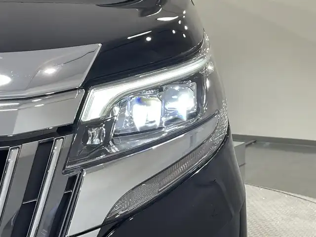 トヨタ エスクァイア ハイブリッド Gi プレミアムパッケージ 愛知県 2018(平30)年 3.4万km ブラック 純正9インチナビ（Bluetooth/フルセグTV/SD/AM/FM/CD/DVD）/純正12.1インチフリップダウンモニター/純正モデリスタフロントエアロ/トヨタセーフティセンス/被害軽減システム/両側パワースライドドア/ビルトインETC/LEDヘッドライト/シートヒーター/ステアリングヒーター/レーンキープアシスト/クルーズコントロール/バックカメラ/USB接続/プッシュスタート/スマートキー/スペアキー/純正フロアマット/純正15インチアルミホイール/ハーフレザーシート/ドアバイザー