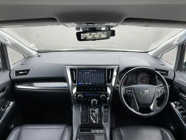トヨタ ヴェルファイア ZG 道央・札幌 2018(平30)年 8.9万km ホワイトパールクリスタルシャイン ４WD/寒冷地仕様/純正ディーラーOPナビ/トヨタセーフティセンス/プリクラッシュセーフティ/横滑り防止装置/レーダークルーズコントロール/レーンキープアシスト/クリアランスソナー/バックカメラ/ビルトインETC2.0/ドライブレコーダー/アイドリングストップ/両側パワースライドドア/パワーバックドア/前席/２列目パワーシート/D席メモリーシート/前席シートヒーター/前席エアシート/N席/２列目オットマン/レザーシート/ステアリングリモコン/ハンドルヒーター/デジタルインナーミラー/電動パーキング/ブレーキホールド/プッシュスタート/スマートキー/LEDヘッドライト/オートライト/オートハイビーム/フォグランプ/電動格納ミラー/ウィンカーミラー/純正フロアマット/スペアキー/純正AW付冬タイヤ積込/235/50/R18/2022年/山8mm