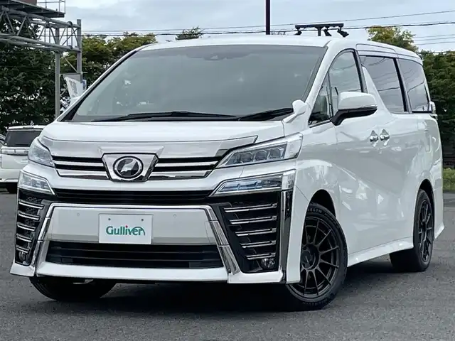 トヨタ ヴェルファイア ZG 道央・札幌 2018(平30)年 8.9万km ホワイトパールクリスタルシャイン ４WD/寒冷地仕様/純正ディーラーOPナビ/トヨタセーフティセンス/プリクラッシュセーフティ/横滑り防止装置/レーダークルーズコントロール/レーンキープアシスト/クリアランスソナー/バックカメラ/ビルトインETC2.0/ドライブレコーダー/アイドリングストップ/両側パワースライドドア/パワーバックドア/前席/２列目パワーシート/D席メモリーシート/前席シートヒーター/前席エアシート/N席/２列目オットマン/レザーシート/ステアリングリモコン/ハンドルヒーター/デジタルインナーミラー/電動パーキング/ブレーキホールド/プッシュスタート/スマートキー/LEDヘッドライト/オートライト/オートハイビーム/フォグランプ/電動格納ミラー/ウィンカーミラー/純正フロアマット/スペアキー/純正AW付冬タイヤ積込/235/50/R18/2022年/山8mm