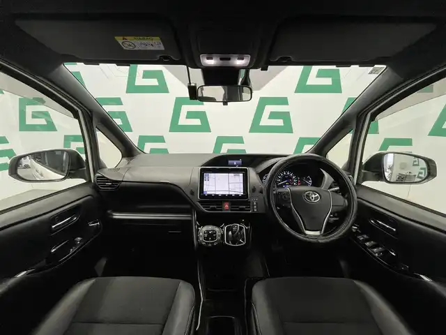 トヨタ ノア ハイブリッド Si ダブルバイビー 鹿児島県 2018(平30)年 8.6万km ホワイトパールクリスタルシャイン 禁煙車/トヨタセーフティセンスC/　・プリクラッシュセーフティ/　・レーンディバーチャーアラート/　・オートマチックハイビーム/先行車発進告知機能/クルーズコントロール(追従走行無し)/純正9型ナビ/　・Bluetooth/　・フルセグTV/　・CD/DVD/　・AM/FM/純正後席モニター/両側パワースライドドア/ETC/モデリスタエアロ/全席オートパワーウィンドウ/純正フロアマット/電動格納ミラー/ステアリングリモコン