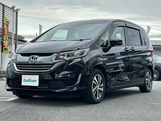 ホンダ フリード ハイブリット EX 奈良県 2018(平30)年 3.5万km プレミアムスパークルブラックパール 1オーナー/社外ナビ(CN-RE04D)/BT/TV/SD//ALPINE後席モニター/両側パワスラ/衝突軽減システム/レーンキープアシスト/追従式レーダークルコン/横滑り防止装置/バックカメラ/ETC/ドラレコ/ハーフレザー/シートヒーター/三列シート/社外フロアマット/カーテンエアバック/保証書・取説・スペアキー付