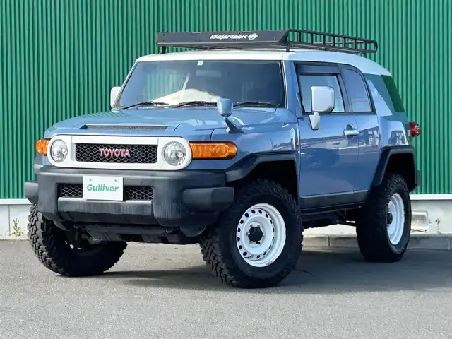 トヨタ ＦＪクルーザー カラーパッケージ 宮城県 2014(平26)年 6.6万km ホワイト/スモーキーブルー JAOS BATTLEZリフトアップ　/BajaRack製ルーフラック/社外メモリナビ（AVIC-RZ801）/・CD/DVD/・Bluetooth/・フルセグTV/バックカメラ/リアパーキングセンサー/革巻きステアリング/クルーズコントロール/HIDヘッドランプ/リモコンキー/スペアキー1本/フロアマット/ドアバイザー/W/サイド/カーテンエアバッグ
