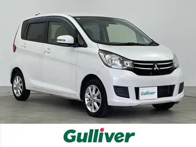 三菱 ｅＫワゴン G　セーフティPKG 大分県 2015(平27)年 3.1万km シルキーホワイト 社外SDナビ/（フルセグ/CD/DVD/AM/FM)/アラウンドビューモニター/衝突軽減ブレーキ/オートハイビーム/オートライト/HIDヘッドライト/オートエアコン/運転席シートヒーター/純正アルミホイール/電動格納ミラー/プッシュスタート・スマートキー/保証書・取扱説明書