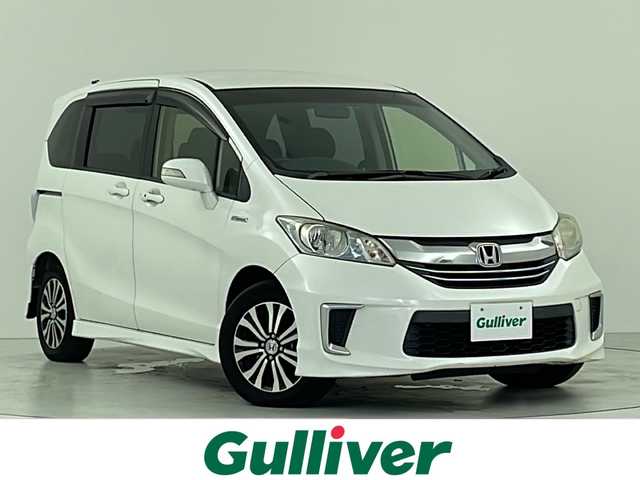 ホンダ フリード ハイブリット ジャストセレクション 大阪府 2014(平26)年 5.6万km ホワイトオーキッドパール ナビ装着用スペシャルパッケージ/純正OPナビ/フルセグTV/BT/CD/DVD/バックカメラ/ETC/両側パワースライドドア/クルーズコントロール/ステアリングスイッチ/革巻ステアリング/横滑り防止装置/オートライト/純正15インチAW/純正フロアマット/純正ドアバイザー