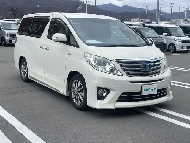トヨタ アルファードハイブリット X 長野県 2012(平24)年 10.9万km ゴールドパールクリスタルシャイン ALPINEナビ/ALPINEフリップダウンモニター/ＣＤ・ＤＶＤ再生/Bluetooth Audio/バックカメラ/両側パワースライドドア/スマートキー/プッシュスタート/HIDライト/オートライト/革調シートカバー/前後ドライブレコーダー/ETC/コーナーセンサー/クルーズコントロール