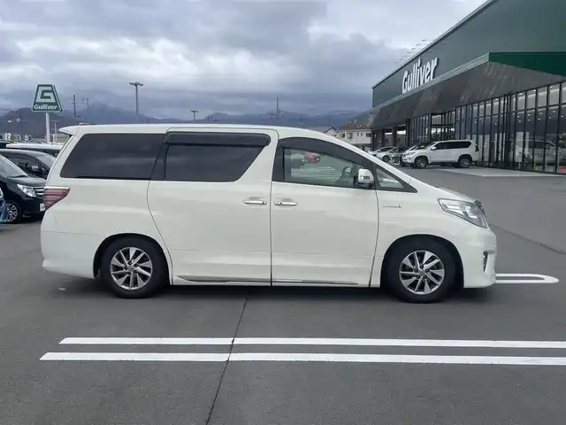 トヨタ アルファードハイブリット X 長野県 2012(平24)年 10.9万km ゴールドパールクリスタルシャイン ALPINEナビ/ALPINEフリップダウンモニター/ＣＤ・ＤＶＤ再生/Bluetooth Audio/バックカメラ/両側パワースライドドア/スマートキー/プッシュスタート/HIDライト/オートライト/革調シートカバー/前後ドライブレコーダー/ETC/コーナーセンサー/クルーズコントロール