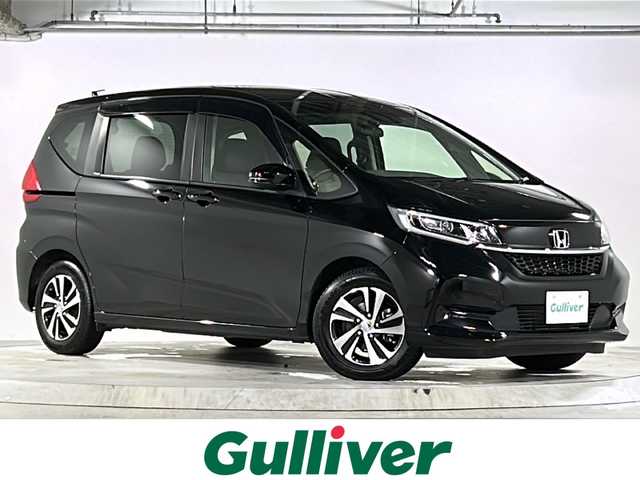 ホンダ フリード G 広島県 2022(令4)年 1.8万km クリスタルブラックパール 禁煙/純正9インチナビ/CD/DVD/DTV/Bluetooth/バックカメラ/両側パワースライドドア/シートヒーター/LEDオートライト/ビルトインETC/前後ドライブレコーダー/ステアリングスイッチ/純正アルミホイール/フロアマット/ドアバイザー/アイドリングストップ/スマートキー/スペアキー/プッシュスタート