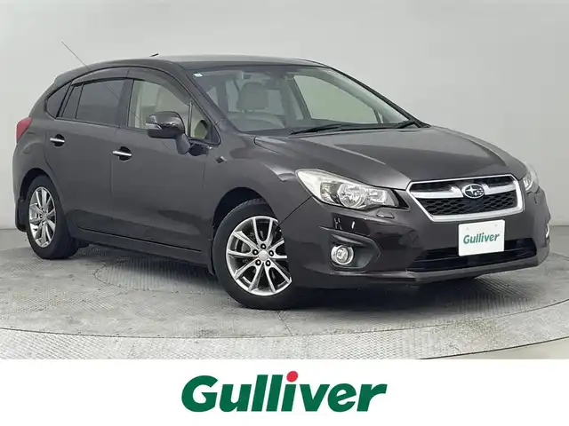 スバル インプレッサ スポーツ 2．0i アイサイト アイボリー 道央・札幌 2013(平25)年 4.3万km ディープチェリーパール ・４ＷＤ/・アイサイト/・社外ナビ/・バックカメラ/・Ｂｌｕｅｔｏｏｔｈ／ＣＤ／ＤＶＤ/・純正ドライブレコーダー/・アイドリングストップ/・アダプティブクルーズコントロール/・レーンキープアシスト/・オートマチックハイビーム/・オートエアコン/・ＥＴＣ/・プッシュスタート/・横滑り防止/・パワーステアリング/・パワーウィンドウ/・パワーシート/・HIDヘッドライト/・社外フロアマット/・純正アルミホイール