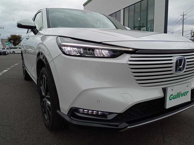 ホンダ ヴェゼル ハイブリッド e:HEV Z 新潟県 2021(令3)年 3.2万km プラチナホワイトパール 4WD/衝突被害軽減システム/レーダークルーズコントロール/純正ナビ（VXU-215VZi）/・（フルセグTV/CD/DVD/Bluetooth）/バックカメラ/ETC/ステアリングスイッチ/パドルシフト/前後ドライブレコーダー/オートブレーキホールド/シートヒーター/オートLEDライト/電動格納ウィンカーミラー/スマートキー