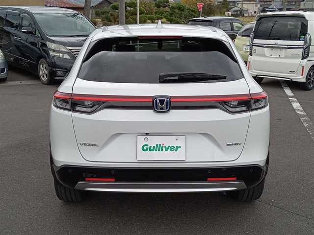 ホンダ ヴェゼル ハイブリッド e:HEV Z 新潟県 2021(令3)年 3.2万km プラチナホワイトパール 4WD/衝突被害軽減システム/レーダークルーズコントロール/純正ナビ（VXU-215VZi）/・（フルセグTV/CD/DVD/Bluetooth）/バックカメラ/ETC/ステアリングスイッチ/パドルシフト/前後ドライブレコーダー/オートブレーキホールド/シートヒーター/オートLEDライト/電動格納ウィンカーミラー/スマートキー