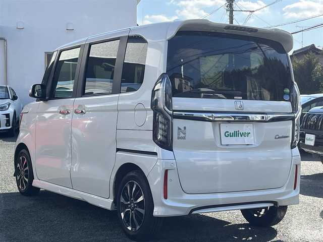 ホンダ Ｎ ＢＯＸ カスタム G L ホンダセンシング 熊本県 2018(平30)年 3.9万km プラチナホワイトパール 純正ナビ（VXM-184VFi）/【フルセグTV/CD/DVD/Bluetooth/ラジオ】/バックカメラ/前シーケンシャルウィンカー/前後ドライブレコーダー（ZDR-015）/片側パワースライドドア/レーダークルーズコントロール/衝突軽減ブレーキ/先行車発進お知らせ機能/レーンキープアシスト/標識認識機能/障害物センサー/ECON/ビルトインETC/純正14インチAW/オートライト/フォグランプ/LEDヘッドライト/ステアリングスイッチ/純正フロアマット/保証書/取扱説明書