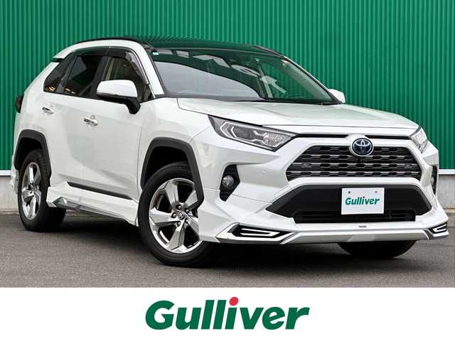 トヨタ ＲＡＶ４ ハイブリッドG 宮城県 2021(令3)年 4.3万km ホワイトパールクリスタルシャイン パノラマムーンルーフ/デジタルインナーミラー/＝＝＝/モデリスタエアロ（F/S/R）/セーフティセンス/・プリクラッシュセーフティ/・レーントレーシングアシスト/・レーダークルーズコントロール/・オートマチックハイビーム/・ロードサインアシスト/先行車発進告知/インテリジェントクリアランスソナー/リアクロストラフィックオートブレーキ/ブラインドスポットモニター/9インチディスプレイオーディオ/・ナビ機能付/・Bluetooth/・フルセグTV/・AppleCarPlay/AndroidAuto/パノラミックビューモニター/ビルトインETC2.0/ドライブレコーダー/AC100V/1500W/ハンズフリーパワーバックドア/合皮シート/運転席メモリー機能付パワーシート/前席シートヒーター/革巻きステアリング/ステアリングヒーター/電動パーキングブレーキ/ブレーキホールド/LEDヘッドランプ/フォグランプ/オートライト/スマートキー＆プッシュスタート/電動格納ミラー/純正18インチAW/純正フロアマット/純正ドアバイザー