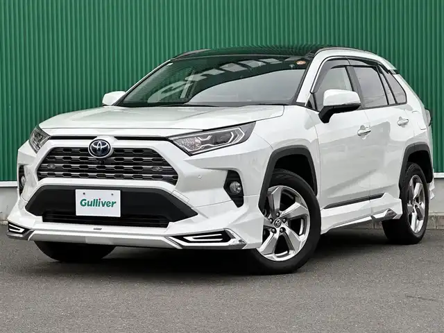 トヨタ ＲＡＶ４ ハイブリッドG 宮城県 2021(令3)年 4.3万km ホワイトパールクリスタルシャイン パノラマムーンルーフ/デジタルインナーミラー/＝＝＝/モデリスタエアロ（F/S/R）/セーフティセンス/・プリクラッシュセーフティ/・レーントレーシングアシスト/・レーダークルーズコントロール/・オートマチックハイビーム/・ロードサインアシスト/先行車発進告知/インテリジェントクリアランスソナー/リアクロストラフィックオートブレーキ/ブラインドスポットモニター/9インチディスプレイオーディオ/・ナビ機能付/・Bluetooth/・フルセグTV/・AppleCarPlay/AndroidAuto/パノラミックビューモニター/ビルトインETC2.0/ドライブレコーダー/AC100V/1500W/ハンズフリーパワーバックドア/合皮シート/運転席メモリー機能付パワーシート/前席シートヒーター/革巻きステアリング/ステアリングヒーター/電動パーキングブレーキ/ブレーキホールド/LEDヘッドランプ/フォグランプ/オートライト/スマートキー＆プッシュスタート/電動格納ミラー/純正18インチAW/純正フロアマット/純正ドアバイザー