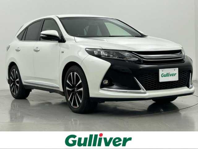 トヨタ ハリアー エレガンス G’s 熊本県 2015(平27)年 5.2万km ホワイトパールクリスタルシャイン 純正ナビ（ＣＤ・ＤＶＤ・フルセグ・ＳＤ・ＢＴ）/バックカメラ　/ビルトインＥＴＣ　/社外前後ドライブレコーダー　/純正エアロ（Ｆ・Ｒ・リアスポイラー）/運転席パワーシート/アイドリングストップ　/横滑り防止/ハーフレザーシート/純正フロアマット/純正19インチAW/オートライト/LEDヘッドライト/フォグライト/スマートキー/プッシュスタート/スペアキー1本/取扱説明書