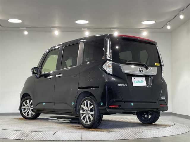 トヨタ ルーミー カスタムG－T 愛知県 2021(令3)年 1.7万km ブラックマイカメタリック 純正９インチナビ/パノラミックビューモニター/両側パワースライドドア/衝突軽減ブレーキ/レーダークルーズコントロール/クリアランスソナー/車線逸脱警報/先行車発進告知/電動パーキングブレーキ/ワイヤレス充電/シートヒーター/デジタルインナーミラー/前後ドライブレコーダー/ビルトインＥＴＣ2.0/USB＆HDMI入力端子/アイドリングストップ/ISOFIX/純正フロアマット/純正15インチアルミホイール