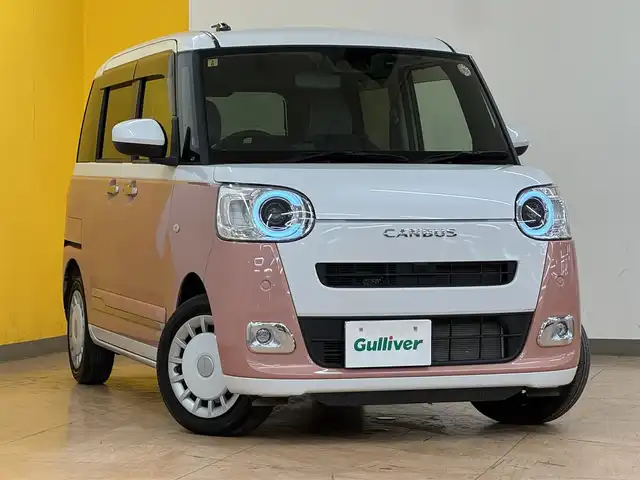 ダイハツ ムーヴ キャンバス ストライプス G 群馬県 2023(令5)年 2.2万km シャイニングホワイトパール/アプリコットピンクメタリック ワンオーナー/スマートアシスト/　・衝突回避支援/　・認識支援/　・駐車支援/純正ナビ/　（AM/FM/CD/DVD/BT/USB）/フルセグTV/バックカメラ/両側パワスラ/USB口×1/前席シートヒーター/オートブレーキホールド/アイドリングストップ/ステアリングスイッチ/ホッとカップホルダー/前方ドライブレコ―ダー/スマートキー/プッシュスタート