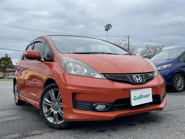 ホンダ フィット RS 群馬県 2011(平23)年 12.9万km サンセットオレンジⅡ 純正メモリナビ・TV・バックカメラ/本革ステアリング/パワーステアリング/パワーウィンドウ/ドアバイザー/純フロアマット/純正ホイール/オートライト/バックカメラ/ビルトインETC/Wエアバック
