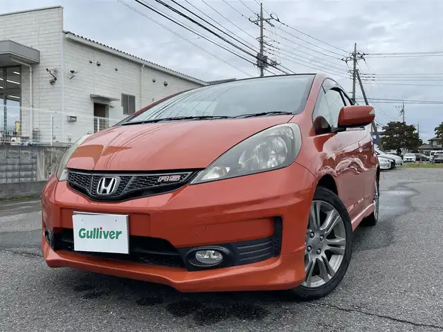 ホンダ フィット RS 群馬県 2011(平23)年 12.9万km サンセットオレンジⅡ 純正メモリナビ・TV・バックカメラ/本革ステアリング/パワーステアリング/パワーウィンドウ/ドアバイザー/純フロアマット/純正ホイール/オートライト/バックカメラ/ビルトインETC/Wエアバック