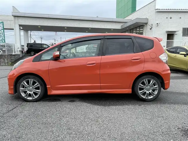 ホンダ フィット RS 群馬県 2011(平23)年 12.9万km サンセットオレンジⅡ 純正メモリナビ・TV・バックカメラ/本革ステアリング/パワーステアリング/パワーウィンドウ/ドアバイザー/純フロアマット/純正ホイール/オートライト/バックカメラ/ビルトインETC/Wエアバック