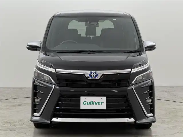 トヨタ ヴォクシー ハイブリッド ZS 煌Ⅲ 福岡県 2021(令3)年 6万km ブラック 純正９型ナビ／フルセグＴＶ　/バックカメラ　/ビルトインＥＴＣ　/クルーズコントロール　/コーナーセンサー　/衝突被害軽減　/レーンキープ　/アクセル踏み間違い防止　/オートマチックハイビーム　/両側電動スライドドア　/ハーフレザーシート　/シートヒーター　/Ｗエアコン　/純正１６インチアルミホイール