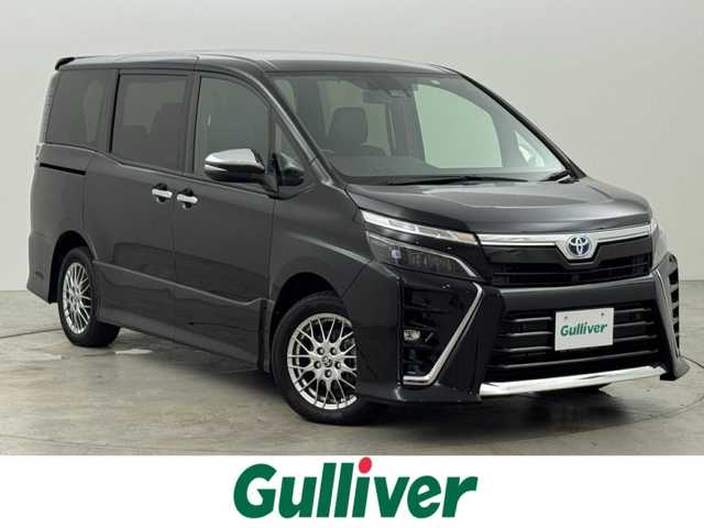 トヨタ ヴォクシー ハイブリッド ZS 煌Ⅲ 福岡県 2021(令3)年 6万km ブラック 純正９型ナビ／フルセグＴＶ　/バックカメラ　/ビルトインＥＴＣ　/クルーズコントロール　/コーナーセンサー　/衝突被害軽減　/レーンキープ　/アクセル踏み間違い防止　/オートマチックハイビーム　/両側電動スライドドア　/ハーフレザーシート　/シートヒーター　/Ｗエアコン　/純正１６インチアルミホイール