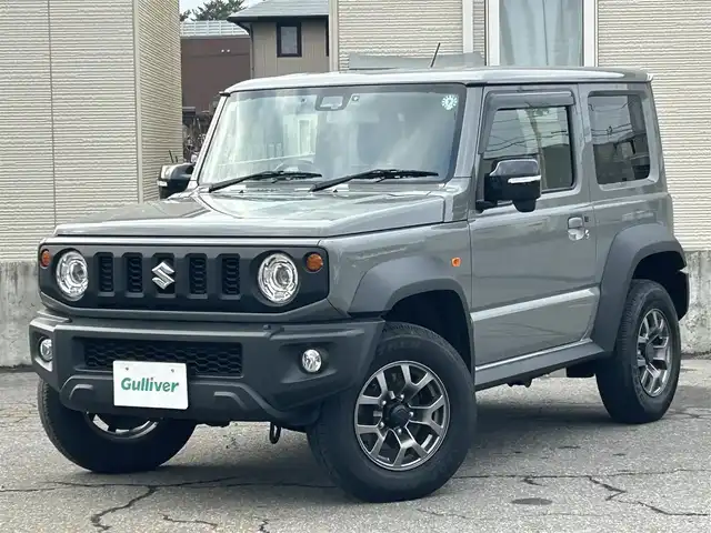 スズキ ジムニー シエラ JC 青森県 2024(令6)年 3万km ミディアムグレー AIS評価点5点/4WD/寒冷地仕様/ワンオーナー/純正メモリナビ/・フルセグTV/Am/FM/CD/DVD/BT/純正15AW/純正フロアマット/シートヒーター前席/コーナーセンサー/フォグランプ/オートライト/クルーズコントロール/アイドリングストップ/衝突軽減システム/ヒルスタートアシスト/車線逸脱警報/横滑り防止機能/盗難防止装置/UVカットガラス/プライバシーガラス/ETC/スペアキー/保証書/取扱説明書/整備記録簿