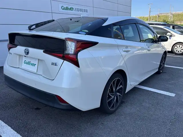 トヨタ プリウス S 長崎県 2019(平31)年 3.5万km ホワイトパールクリスタルシャイン ワンオーナー/純正メモリナビ/（CD/DVD/BT/フルセグ）/バックカメラ/衝突軽減システム/レーンアシスト/レーダークルーズ/ETC/モデリスタ17インチAW/ステアリングスイッチ/オートライト/スマートキー/プッシュスタート