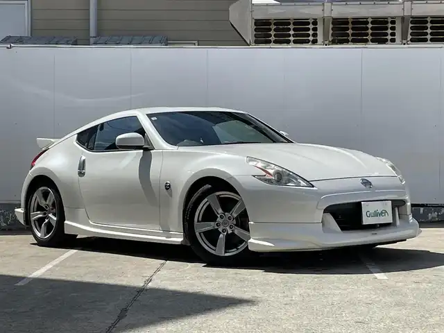 日産 フェアレディ Ｚ バージョンT 青森県 2009(平21)年 9.3万km ブリリアントホワイトパール 純正メモリナビ/AM/FM/CD/DVD/AUX/NISMOエアロ/V6ツインターボ/柿本マフラー/バックカメラ/社外ドライブレコーダー/シートヒーター/ハーフレザーシート/パドルシフト/純正フロアマット/スペアキー/純正AWサマータイヤ/取扱説明書/保証書