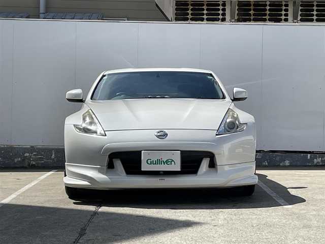 日産 フェアレディ Ｚ バージョンT 青森県 2009(平21)年 9.3万km ブリリアントホワイトパール 純正メモリナビ/AM/FM/CD/DVD/AUX/NISMOエアロ/V6ツインターボ/柿本マフラー/バックカメラ/社外ドライブレコーダー/シートヒーター/ハーフレザーシート/パドルシフト/純正フロアマット/スペアキー/純正AWサマータイヤ/取扱説明書/保証書