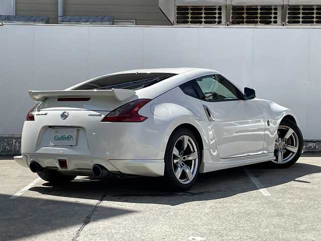 日産 フェアレディ Ｚ バージョンT 青森県 2009(平21)年 9.3万km ブリリアントホワイトパール 純正メモリナビ/AM/FM/CD/DVD/AUX/NISMOエアロ/V6ツインターボ/柿本マフラー/バックカメラ/社外ドライブレコーダー/シートヒーター/ハーフレザーシート/パドルシフト/純正フロアマット/スペアキー/純正AWサマータイヤ/取扱説明書/保証書