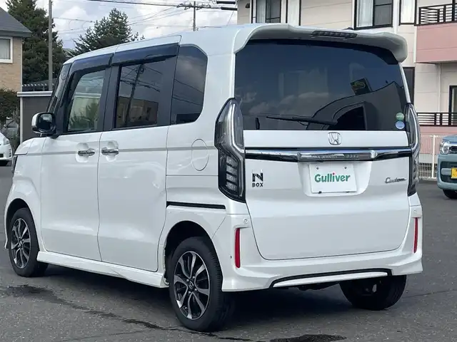 ホンダ Ｎ ＢＯＸ カスタム G L ホンダセンシング 道央・札幌 2019(平31)年 10.2万km プラチナホワイトパール 　４　W　D　/純正メモリナビ/（CD/DVD/FM/AM/SD/BT)/フルセグ（走行中視聴可能）/バックカメラ/ウィンカーミラー/クルーズコントロール/ドアバイザー/プッシュスタート/片側パワースライドドア/ビルトインETC/オートライト/フォグランプ/前席シートヒーター/コーナーセンサー（前）/ステアリングスイッチ/ベンチシート/フルフラットシート/チップアップシート/レーンキープアシスト/衝突軽減ブレーキ/横滑り防止装置/サイドエアバッグ/カーテンエアバッグ