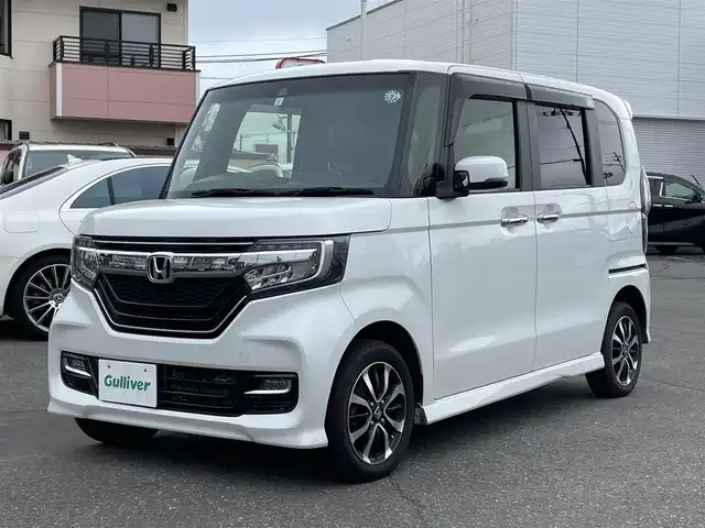 ホンダ Ｎ ＢＯＸ カスタム G L ホンダセンシング 道央・札幌 2019(平31)年 10.2万km プラチナホワイトパール ４WD/純正メモリナビ（CD/DVD/FM/AM/SD/BT)/フルセグ（走行中視聴可能）/バックカメラ/ウィンカーミラー/クルーズコントロール/ドアバイザー/プッシュスタート/片側パワースライドドア/ビルトインETC/オートライト/フォグランプ/前席シートヒーター/コーナーセンサー（前）/ステアリングスイッチ/ベンチシート/フルフラットシート/チップアップシート/レーンキープアシスト/衝突軽減ブレーキ/横滑り防止装置/サイドエアバッグ/カーテンエアバッグ